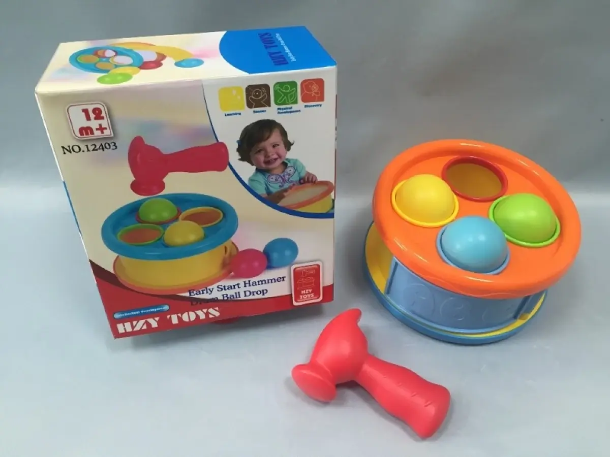 Baby drum with ball drop and hammer